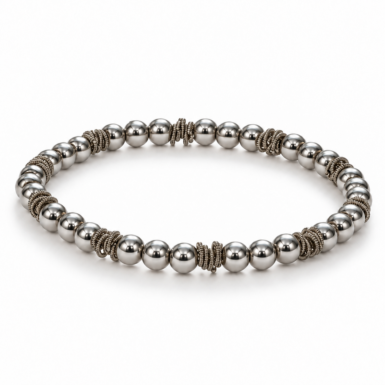 Staccato Steel Stretch Bracelet in silver, polished stainless steel beads with guitar string circlets, angled view
